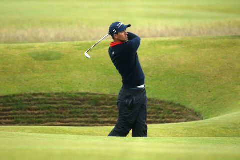 Adam Scott of Australia finished tied for 10th place. Here he plays an approach on the 14th hole.