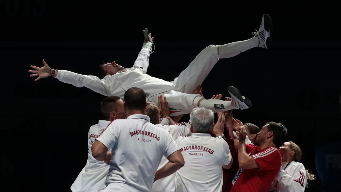 Hungarian fencer Geza Imre is thrown in the air by his teammates after he won gold in the individual epee competition at the World Fencing Championships in Moscow on Wednesday, July 15.