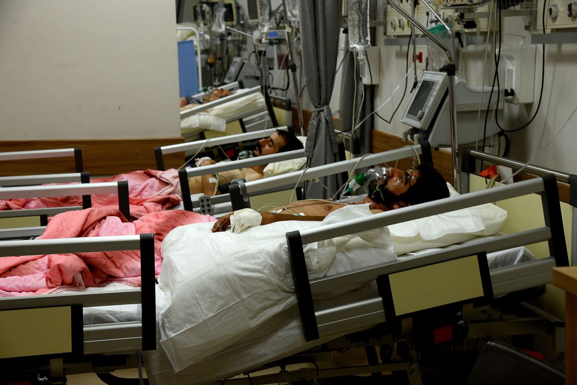 Wounded men lie in a hospital on July 20.