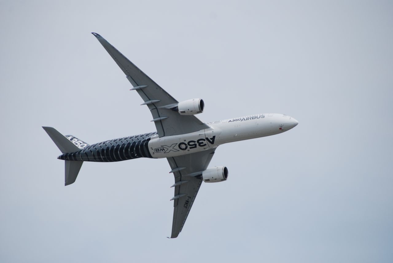 A test pilot put the A350XWB through its paces over tiny Wittman Regional Airport. Maneuvers included tight turns and low passes over the airfield. The super-efficient airliner seats more than 300 passengers. American Airlines is set to be the first carrier in North America to fly it, beginning in 2017. 