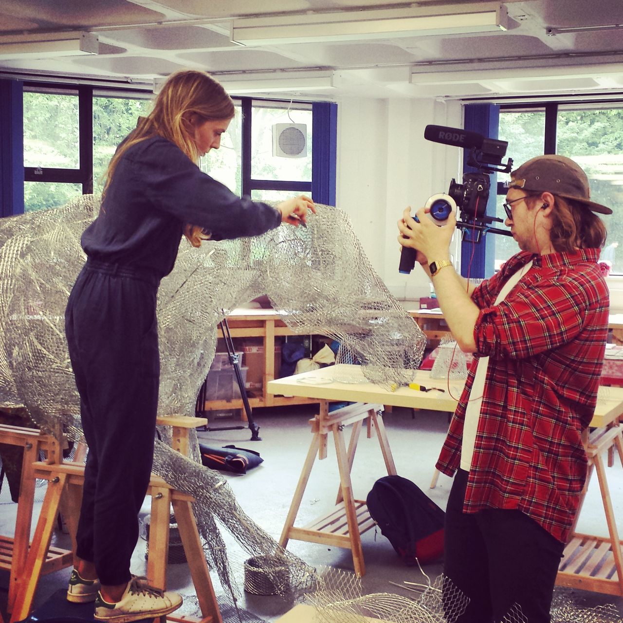 Dumon (left) at work on her Ascot sculpture. The 24-year-old uses chicken wire which she cuts into pieces and reshapes.