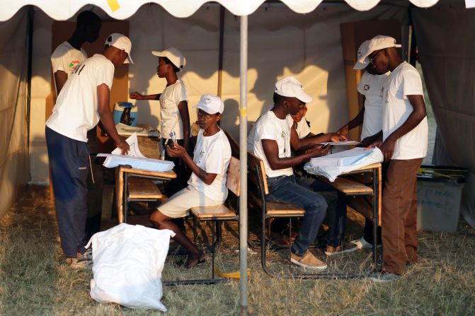 Election officials prepare the ballots on July 21.