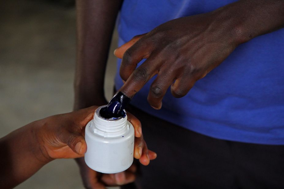 A man has his fingers inked in order to vote at a polling station in Bujumbura on July 21.