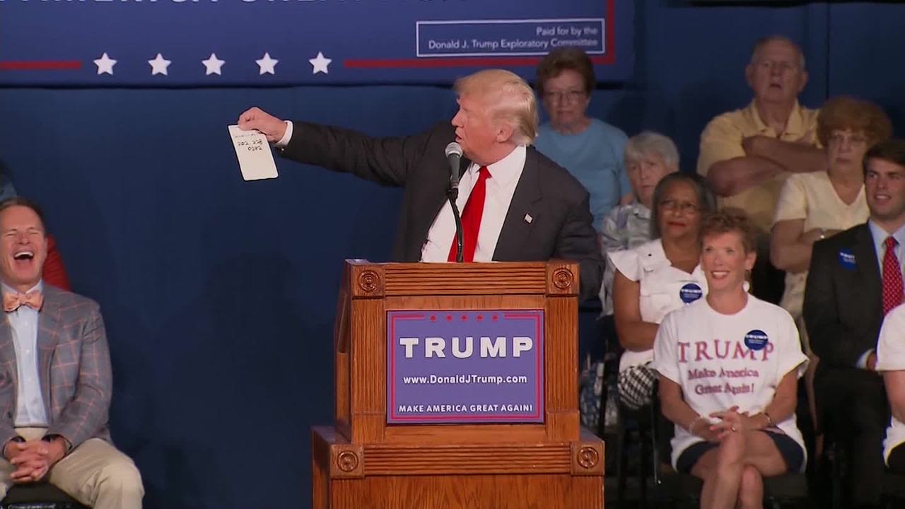 Trump gives out U.S. Sen. Lindsey Graham's private cell phone number at a rally in Graham's home state of South Carolina on July 22. He urged attendees to "give it a shot" and call it. The two presidential candidates engaged in a feud in which Graham called Trump a "jackass" and Trump called Graham "a total lightweight."