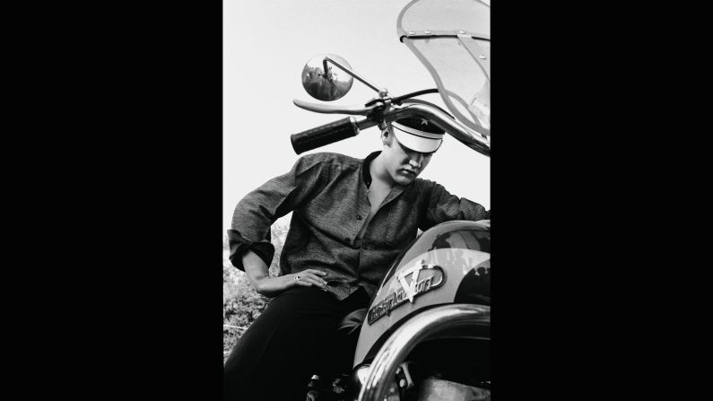 Also good for the bad-boy image: a motorcycle. This 1956 photo can't help but recall another '50s bad boy, <a href="https://homespunlondon.files.wordpress.com/2013/11/marlon-brando-the-wild-one-johnny.jpg" target="_blank" target="_blank">Marlon Brando in "The Wild One."</a> "Elvis had animal magnetism," singer Ian Hunter said. "He was even sexy to the guys. I can't imagine what the chicks used to think." 