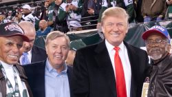 Sen. Lindsey Graham and Donald Trump participate in The NFL And Red Tails Salute To The Tuskegee Airmen On Veteran's Day Weekend During the New York Jets Vs. New England Patriots Game at Met Life Stadium on November 13, 2011 in East Rutherford, New Jersey.