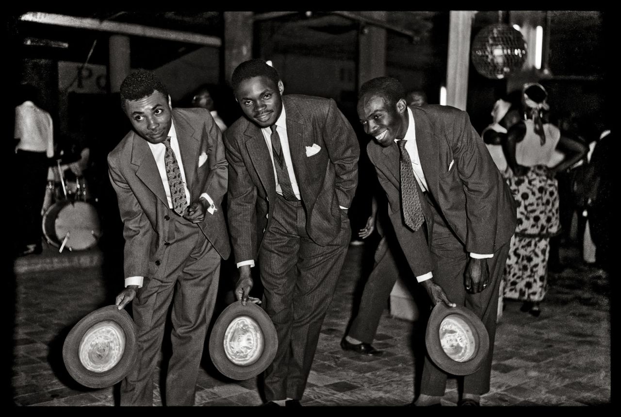 Jean Depara captured the glamor of 1950s Léopoldville (now Kinshasa) in his photographs. He was the designated photographer for the the musician Franco, and enjoyed nightclubs in the late hours to snap people as they left. He also followed the Bills -- the term for young Congolese men from working class neighborhoods who styled themselves after actors from American Westerns. (Pictured: Untitled, c. 1955-65)