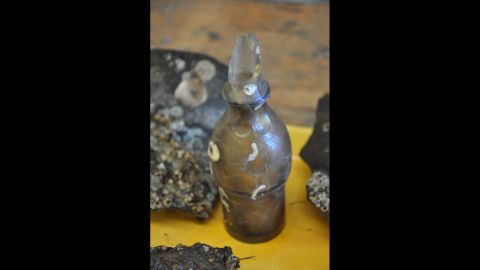 A glass top from what archaeologists believe was a condiment bottle.