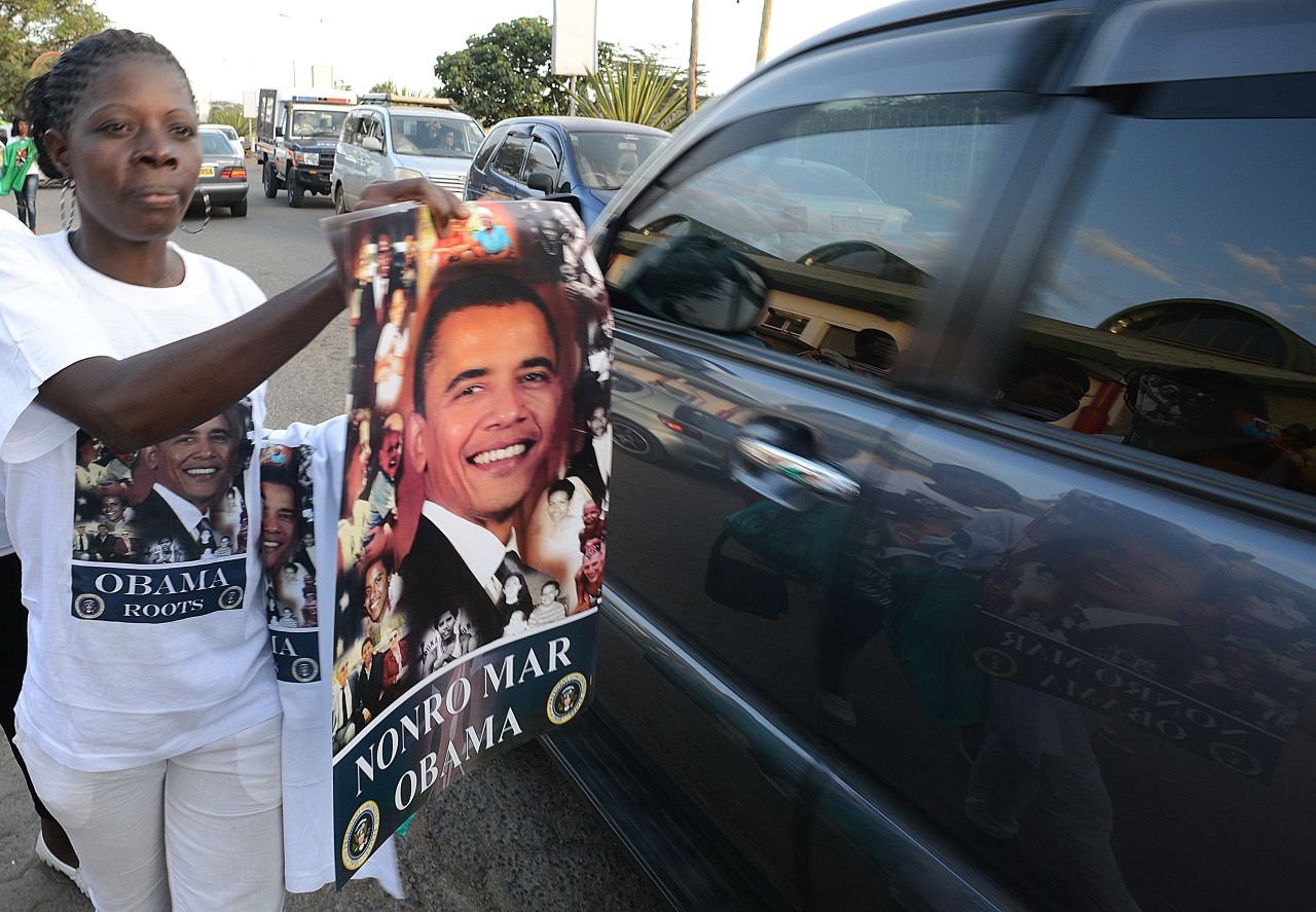 Posters with the image of Barack Obama are offered for sale to motorists in Nairobi, ahead of the U.S. president's visit to Kenya.