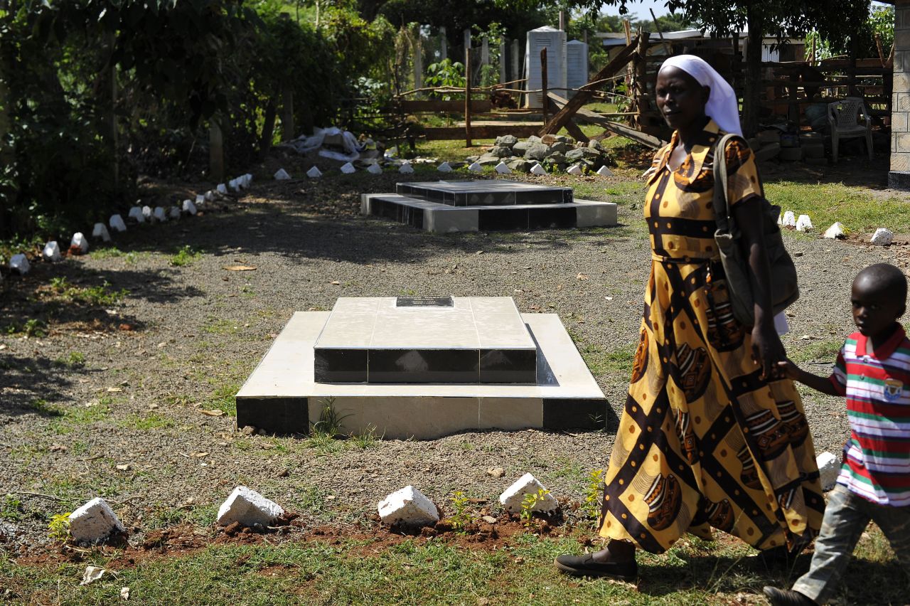 A visitor walks past the graves site of Barack Obama senior at the homestead of Sarah Onyango Obama, the President's step grandmother, at her home in Kogelo, western Kenya.