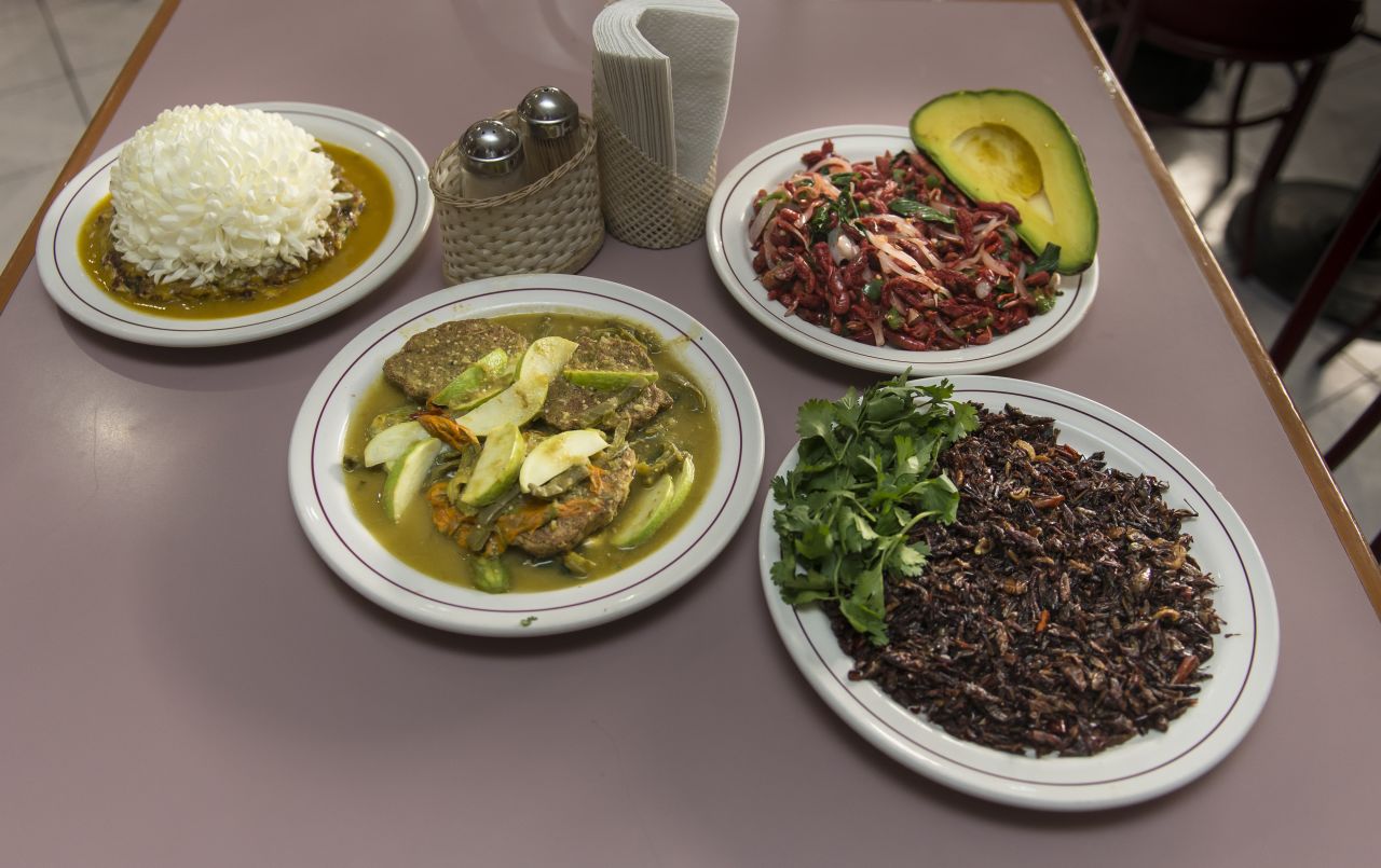 Don Chon restaurant in Mexico City: plates of ant eggs with small pancakes of mosquito eggs, cactus leaves, pumpkin flowers and "chapulines" (grasshoppers). 