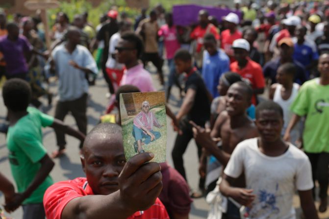 Hundreds gather Thursday, July 23, for the funeral procession of Emmanuel Ndere Yimana, an opposition supporter slain the day before in Bujumbura, Burundi. The Associated Press said Yimana is thought to be another victim of violence targeting those opposed to President Pierre Nkurunziza's bid for a third term in office. Critics say a third term is prohibited by a peace accord that ended the country's 1993-2003 civil war.