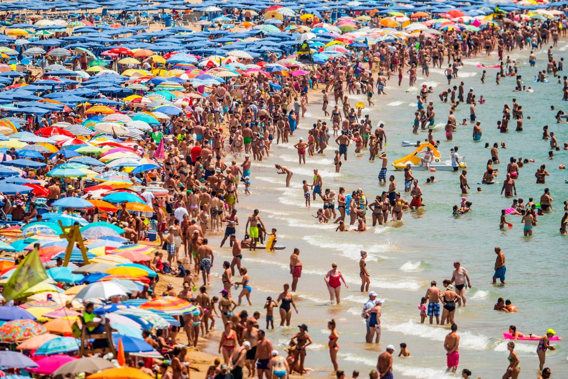 People sunbathe en masse at Levante Beach in Benidorm, Spain, on July 22, 2015. Spain has set a new record for tourists, with 29.2 million visitors in the first half of 2015 -- a 4.2% increase from the same period in 2014 -- according to <a href="http://www.iet.tourspain.es/es-ES/estadisticas/frontur/mensuales/Nota%20de%20coyuntura%20de%20Frontur.%20Junio%202015.pdf" target="_blank" target="_blank">figures</a> from tourism department Frontur.