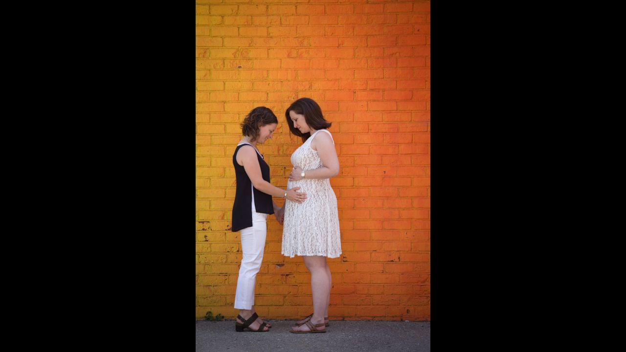 Nathania, left, and Ilana Horowitz admire Ilana's pregnant belly carrying twins. They are both social workers living in Queens, New York, and have been together for five years. They are expecting a boy and a girl. Having their marriage nationally recognized gives their family security, Nathania said. <a href="http://www.stevenrosenphotography.com/" target="_blank" target="_blank">Steven Rosen</a> photographed their wedding day.