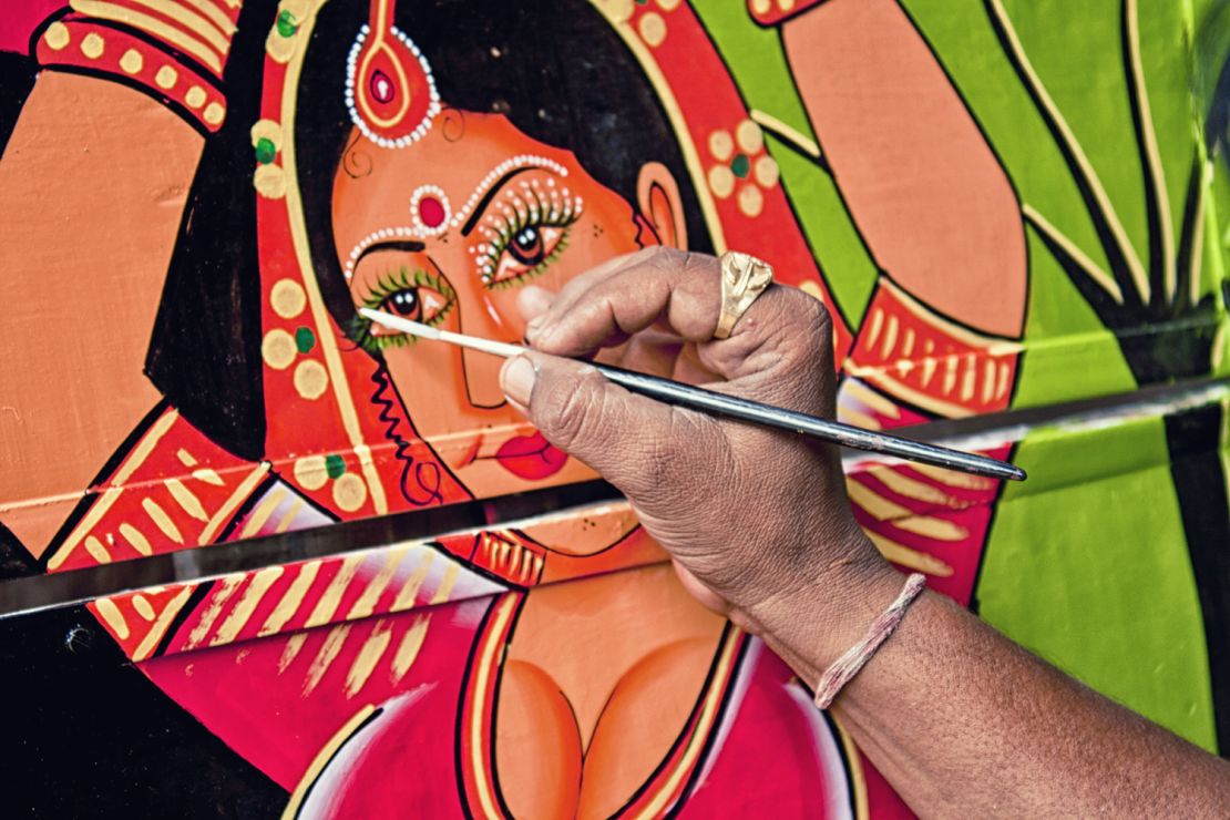 Truck artist Raja Gharu works his magic.