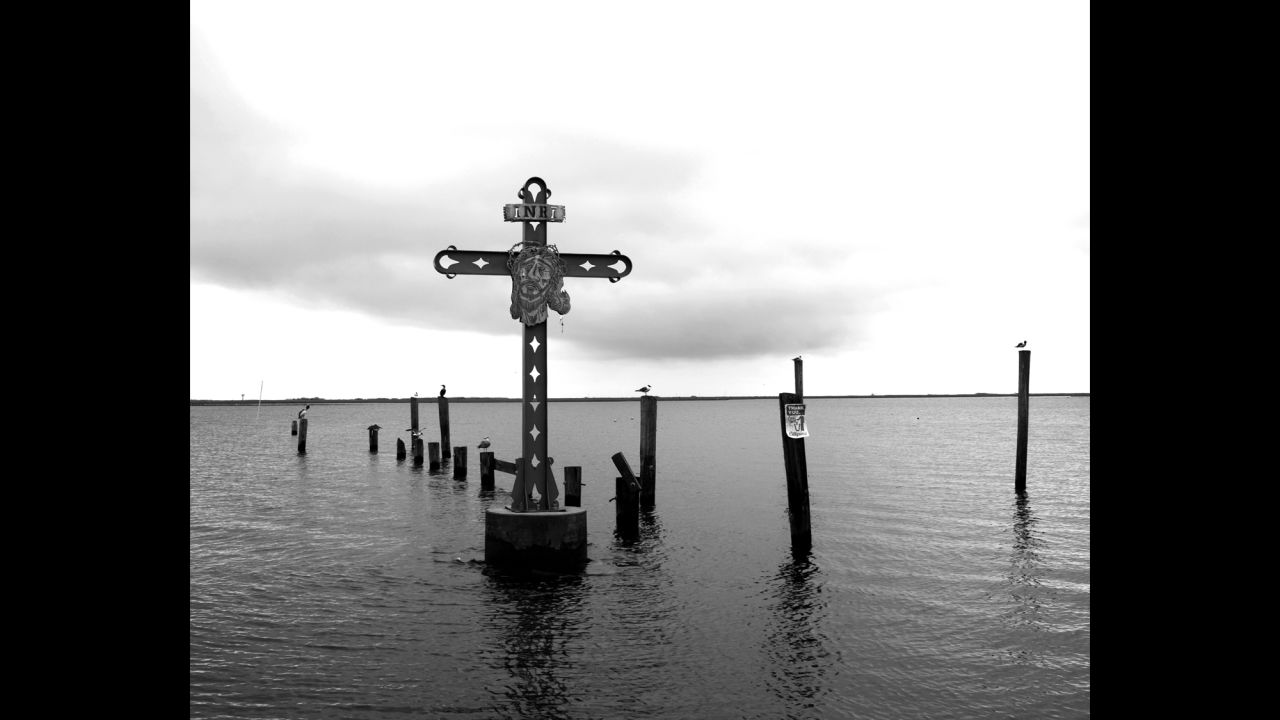 A cross in the water off Shell Beach, Louisiana, honors victims of Katrina who were from St. Bernard Parish. According to FEMA, Katrina was "the single most catastrophic natural disaster in U.S. history."