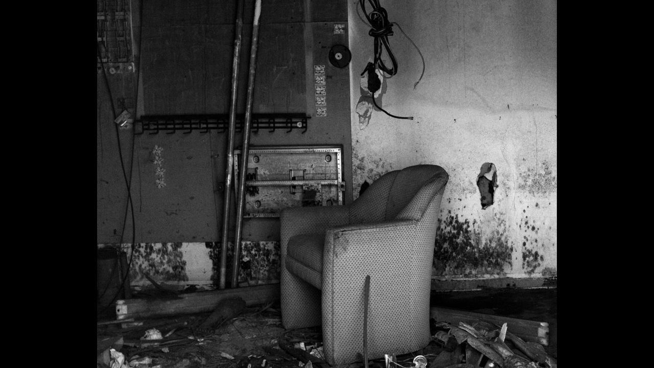 A hotel chair sits inside a former Ramada hotel in New Orleans. The hotel, which is now abandoned, sustained 4 feet of flooding during Katrina. 