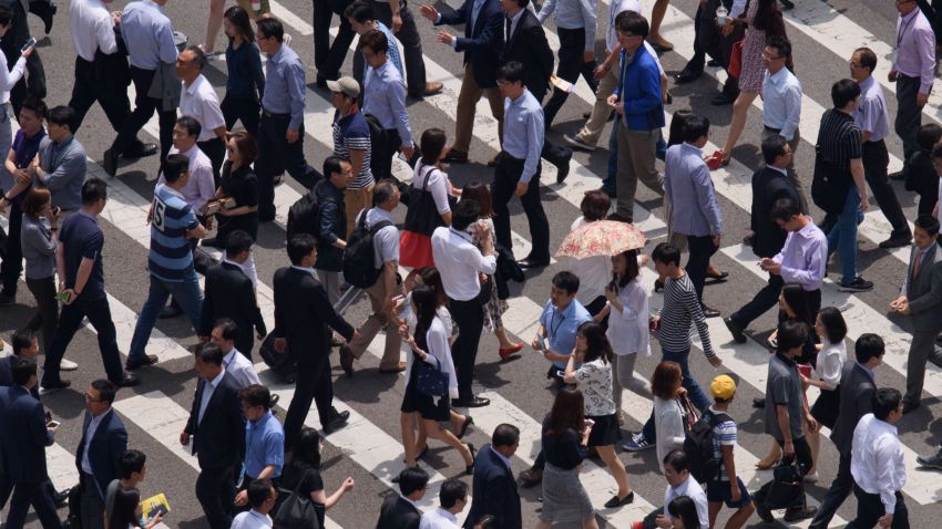 People cross a street in Seoul on June 2, 2015. South Korea's health ministry confirmed that two people have died from Middle East Respiratory Syndrome (MERS), the country's first fatalities from the virus. AFP PHOTO / Ed Jones ED JONES/AFP/Getty Images