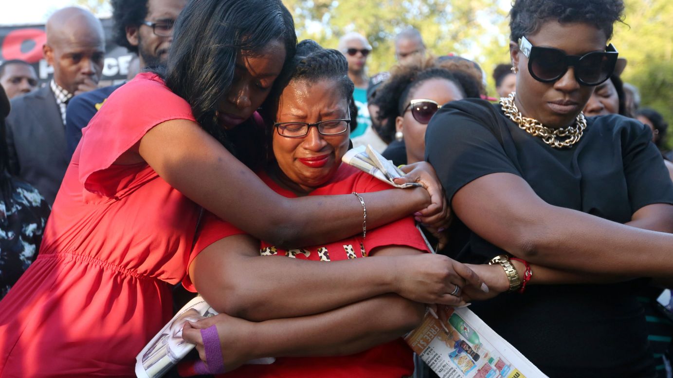 Lanitra Dean hugs Carlesha Harrison, a friend of Sandra Bland, <a href="http://www.cnn.com/2015/07/20/us/gallery/sandra-bland-texas-jail-death-vigil/index.html" target="_blank">during Bland's vigil</a> Sunday, July 19, in Prairie View, Texas. Bland was arrested on July 10 for allegedly assaulting an officer during a routine traffic stop. On July 13, she was found dead in her jail cell. Police say the 28-year-old hanged herself with a plastic bag. Her family disputes that.