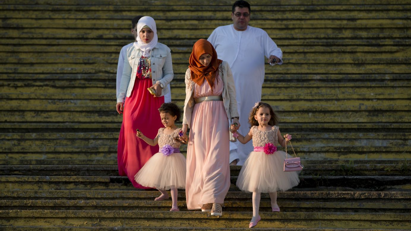 A family arrives for Eid al-Fitr prayers in Bucharest, Romania, on Friday, July 17. The Eid al-Fitr festival marks the end of Ramadan, the Islamic holy month.