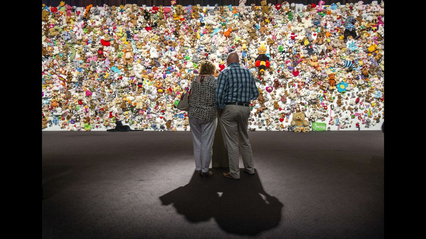 Mourners in Nieuwegein, Netherlands, gather in front of a "hedge of compassion" -- made of thousands of stuffed animals -- prior to a ceremony Friday, July 17, for those who died in the crash of Malaysia Airlines Flight 17. Flight 17 was shot down over Ukraine last year, killing all 298 people aboard. Of the people who died, 193 were Dutch citizens.