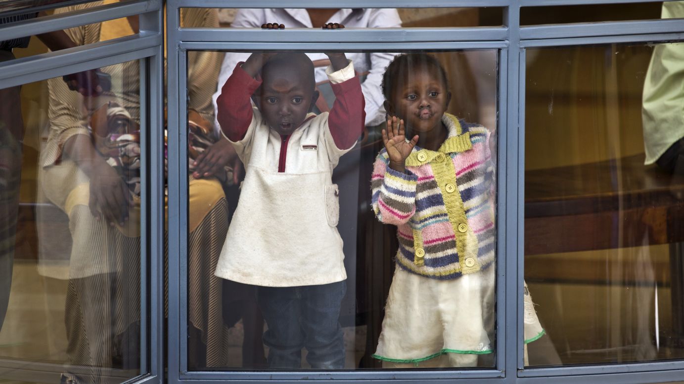 Two children look out from an upper level of the <a href="http://www.cnn.com/2015/07/18/africa/kenya-westgate-mall-reopens/" target="_blank">reopened Westgate Shopping Mall</a> on Saturday, July 18, nearly two years after a terrorist attack left at least 67 people dead there in Nairobi, Kenya.