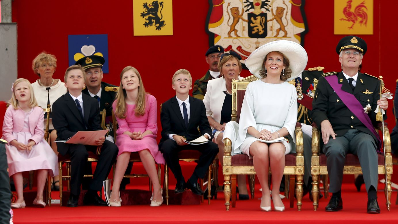 Belgium's King Philippe and Queen Mathilde watch a traditional military parade in Brussels with their children -- from left, Princess Eleonore, Prince Gabriel, Crown Princess Elisabeth and Prince Emmanuel -- on Tuesday, July 21. It was Belgium's National Day.