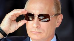 Russian Prime Minister Vladimir Putin adjusts his sunglasses as he watches an air show during MAKS-2011, the International Aviation and Space Show, in Zhukovsky, outside Moscow, on August 17, 2011. AFP PHOTO / DMITRY KOSTYUKOV (Photo credit should read DMITRY KOSTYUKOV/AFP/Getty Images)
