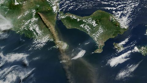 Mt. Raung is seen spewing ash and volcanic gases in this image taken on July 12 by NASA's Aqua satellite. The eruption forced hundreds of flights to and from Bali and other regional airports to be canceled. The ash clouds went as high as 20,000 feet (6 kilometers) into the air.