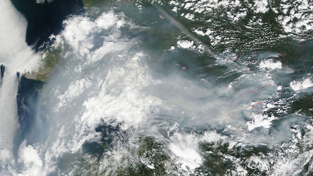 Fires have burned thousands of acres in Alaska. NASA's Terra satellite took this photo of smoke of smoke and haze over Alaska on July 12. Fires are outlined in red. The Alaska Interagency Coordination Center says about 300 fires were actively burning when the image was taken. 
