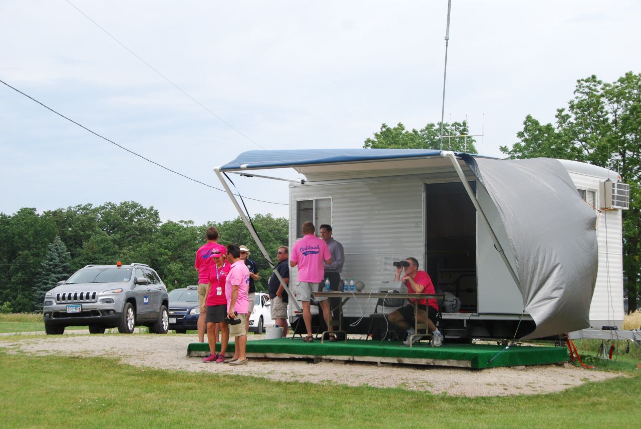 FAA air traffic controllers watch for approaching aircraft at a makeshift station about 6 miles from Oshkosh.
