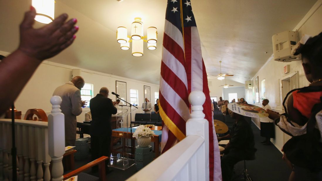 Parishioners gather during Sunday services in the rebuilt church on May 10, 2015.