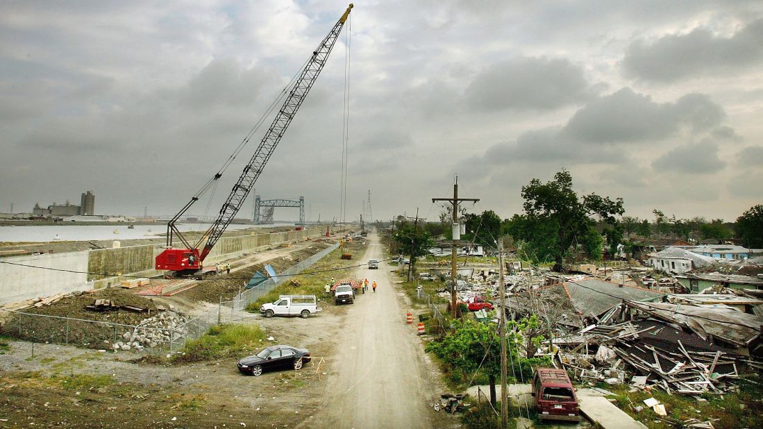 On April 25, 2006, workers in the Lower Ninth Ward rebuild the levee that was breached by Hurricane Katrina along the Industrial Canal.