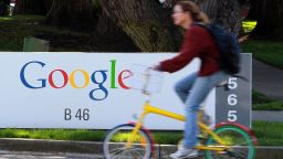 A bicyclist rides by a sign at the Google headquarters March 10, 2010 in Mountain View, California. Google announced today that they are adding bicycle routes to their popular Google Maps and is available in 150 US cities.