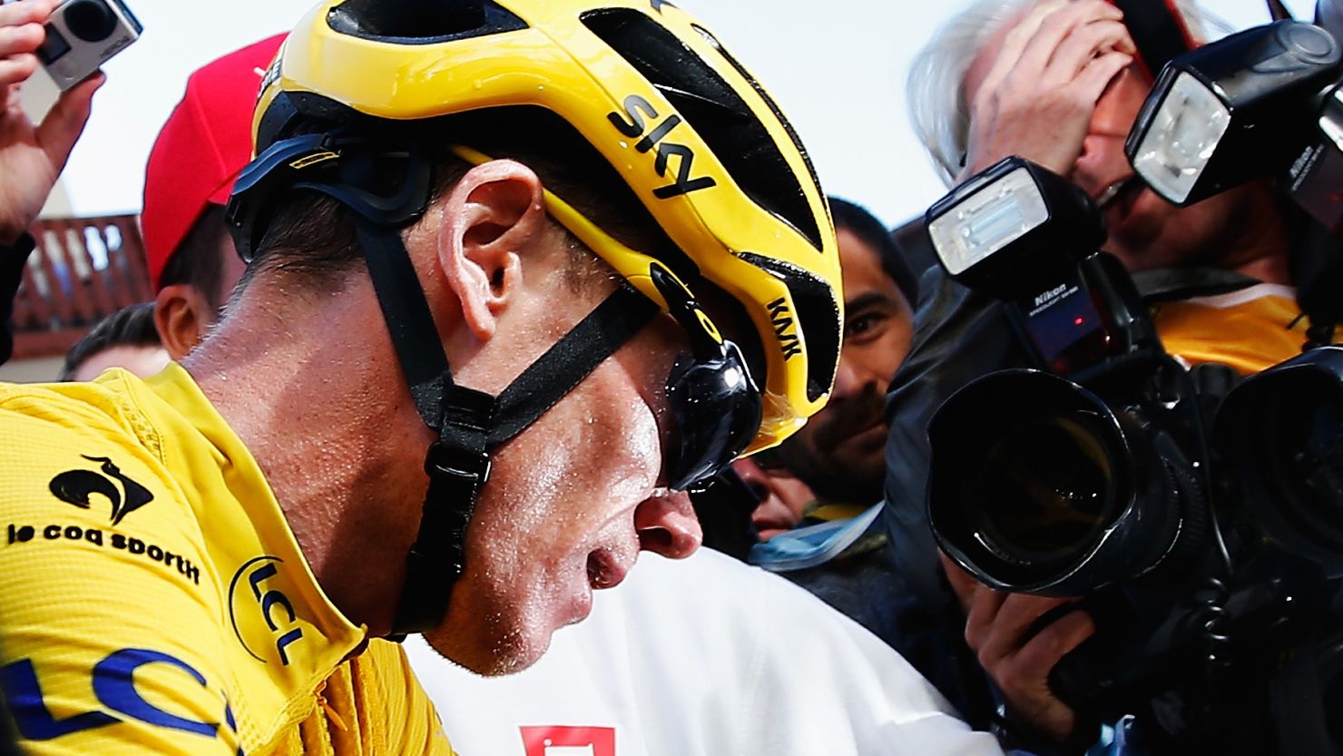 Chris Froome is surrounded by the media after keeping the yellow jersey ahead of the final stage of the Tour de France.