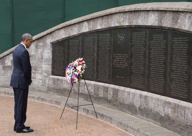 Obama pays his respects after laying a wreath at the Memorial Park in Nairobi on July 25. The park commemorates the 1998 truck bombing of the U.S. Embassy there, which killed a dozen Americans and more than 200 Kenyans. Almost simultaneously, 11 people were killed in a similar attack on the U.S. Embassy in Tanzania's capital.