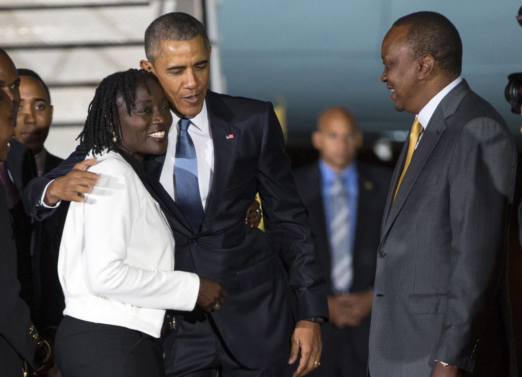 Kenyatta watches as Obama hugs his half-sister Auma on July 24.