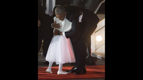 Obama hugs Joan Wamaitha, 8, upon his arrival in Kenya on July 24. 