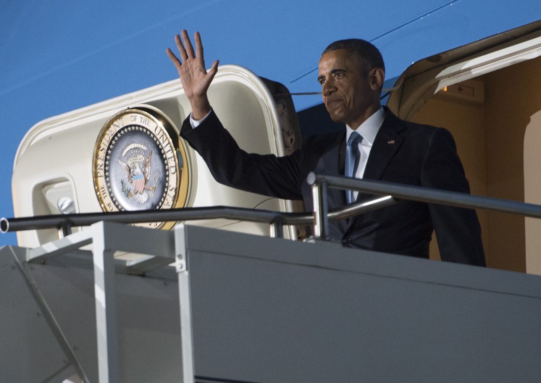 Obama waves from the door of Air Force One after arriving in Kenya on July 24.