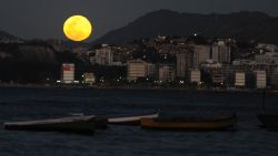 The full moon rises over Rio de Janeiro on August 31, 2012. According to NASA, this is the second time in August that a full moon is seen - the first was on August 1 to 2. This phenomenon, which is referred to as the 'blue moon', happens every two and a half years on average. AFP PHOTO/VANDERLEI ALMEIDA (Photo credit should read VANDERLEI ALMEIDA/AFP/Getty Images)