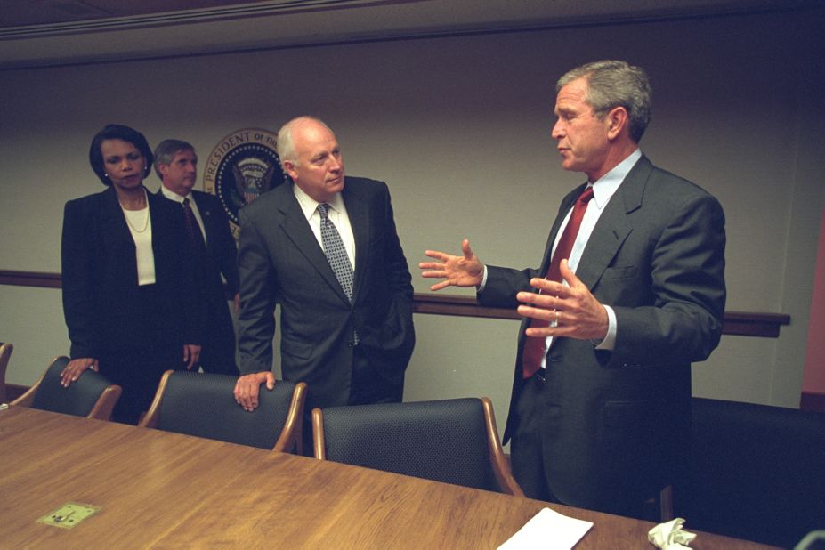 The photos capture the grim scenario facing the White House as commandeered airliners crashed into the World Trade Center, the Pentagon and a field in Pennsylvania. President George W. Bush, Cheney and staff gather at the President's Emergency Operations Center later in the day.