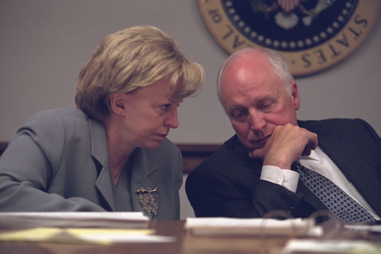 Lynne Cheney discusses the ongoing crisis with her husband, the vice president. According to a 2002 CNN article on the attack anniversary, Dick Cheney helped direct the U.S. government's response from an emergency bunker while the President was in Florida and flying to Nebraska for security reasons. Bush issued orders while in transit.<br />