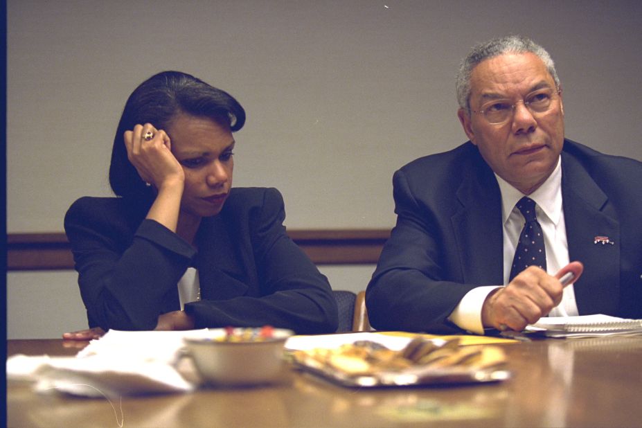 Rice and Secretary of State Colin Powell confer during the crisis.