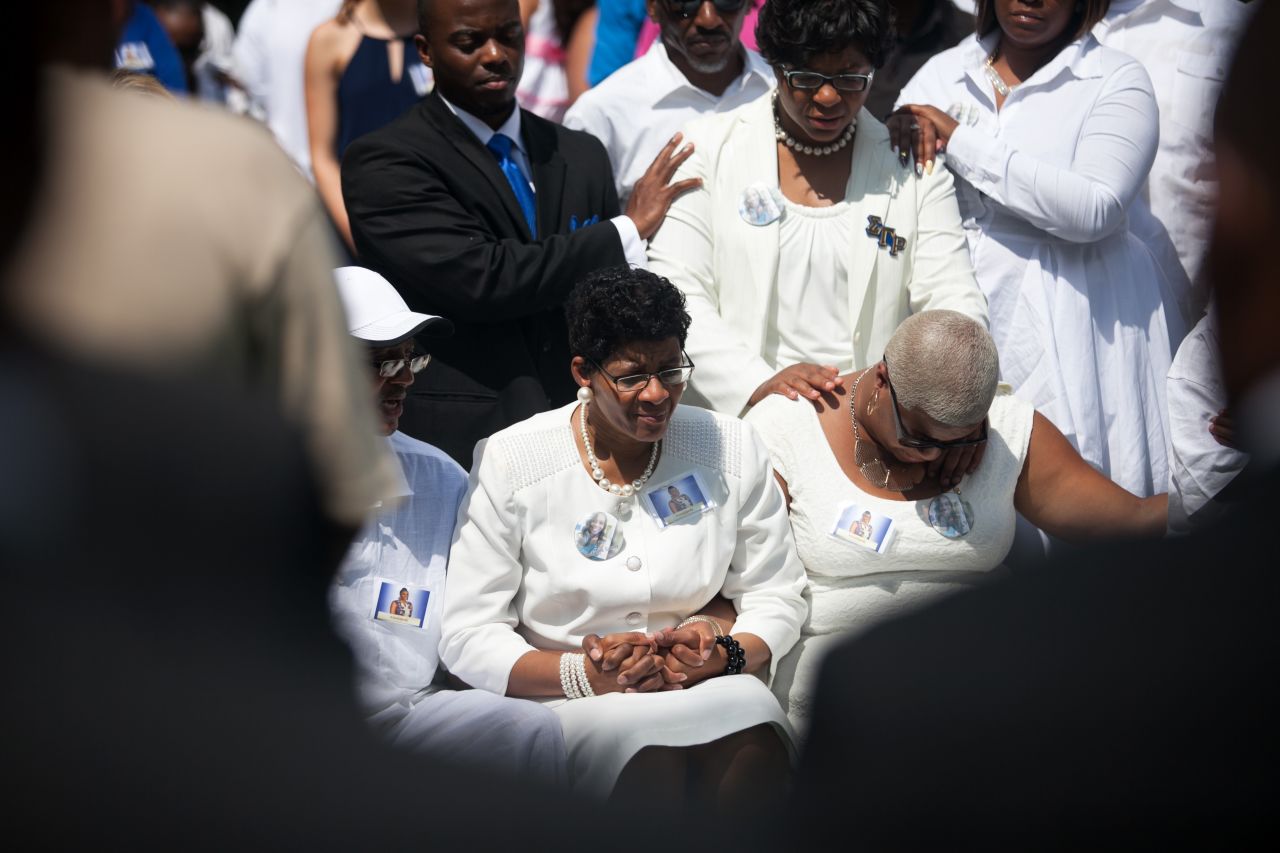 The mother of Sandra Bland, Geneva Reed-Veal, center, and sister Shavon Bland mourn at the gravesite during the funeral at Mount Glenwood Memory Gardens West cemetery, on Saturday, July 25, in Willow Springs, Illinois. Bland was arrested on July 10 for allegedly assaulting an officer during a routine traffic stop. On July 13, she was found dead in her jail cell. Police say the 28-year-old hanged herself with a plastic bag. Her family disputes that.