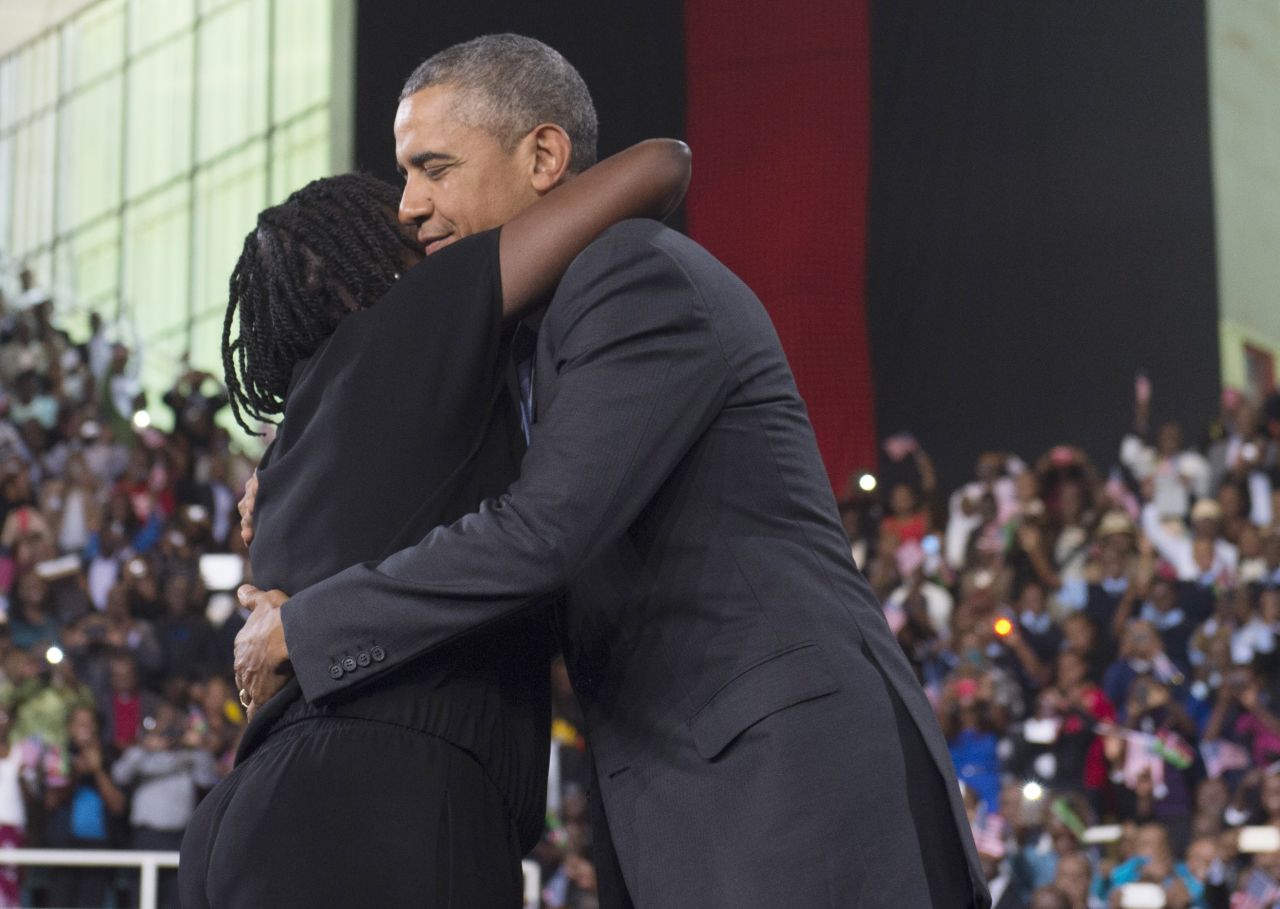 Obama embraces his half-sister Auma Obama during an event at the Moi International Sports Center on July 26. She introduced Obama to the crowd, saying her brother "continues to be very attached to us." The President spent portions of each night in Kenya with relatives.