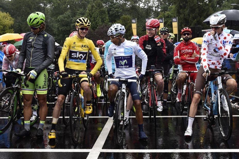 Froome lines up before the start of the final stage with white jersey winner and second placed Nairo Quintana and green jersey winner Peter Sagan.