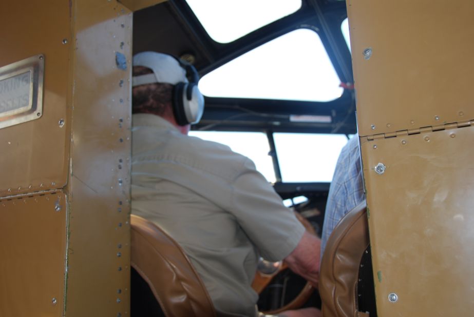 The flight deck is cramped and located adjacent to the passenger cabin. Note the glass ceiling, which offered 1920s pilots more visibility to guard against oncoming traffic in a pre-radar tracking era. 