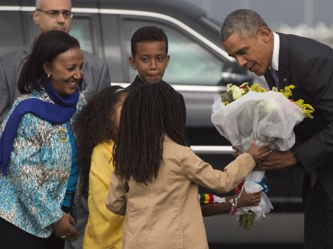 Obama receives flowers Sunday, July 26, upon his arrival at Bole International Airport in Addis Ababa.