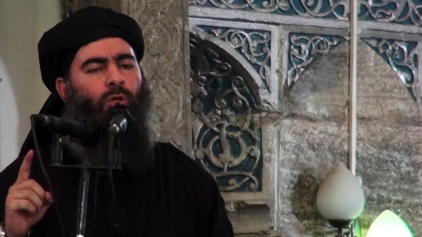 An image grab taken from a propaganda video released on July 5, 2014 by Al-Furqan Media allegedly shows the leader of the Islamic State (IS) jihadist group Abu Bakr al-Baghdadi, aka Caliph Ibrahim, adressing Muslim worshippers at a mosque in the militant-held northern Iraqi city of Mosul. Baghdadi, the self-proclaimed caliph of the brutal jihadist Islamic State (IS) group that has seized large chunks of Iraq and Syria, made the AFP shortlist of most influential people of 2014. AFP PHOTO / HO / AL-FURQAN MEDIA 