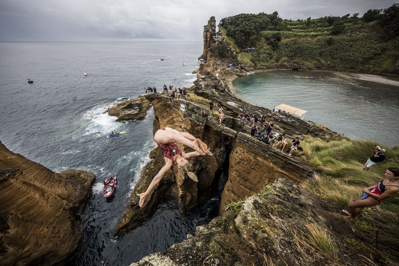Lysanne Richard of Canada dives into the waters around Vila Franca do Campo on July 17, 2015. The islet is created by the crater of an ancient, submerged volcano.